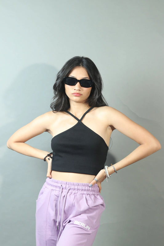 Achieve casual coolness with this women's black crop tank top, a stylish and comfortable option for creating laid-back outfits.
