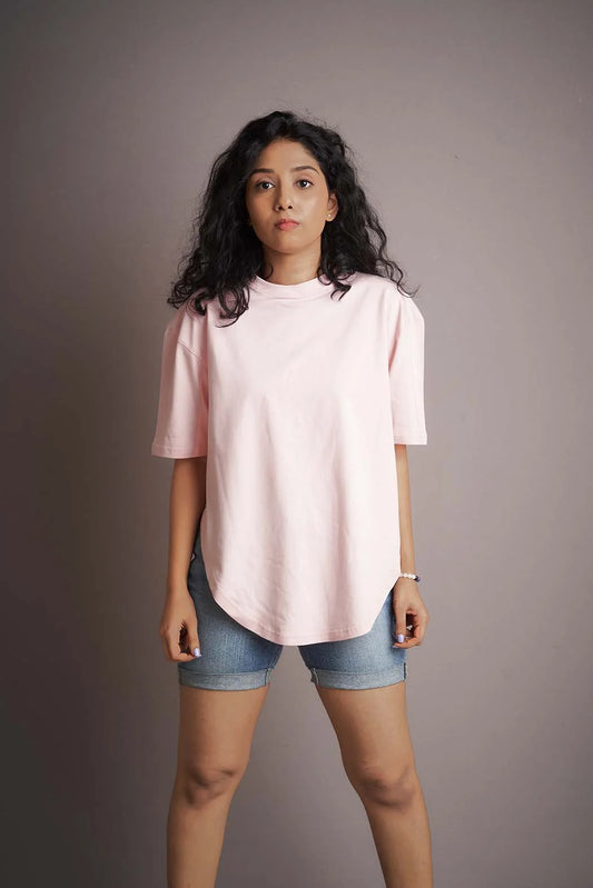 Step into brightness and trendiness with this pink-colored apple-cut T-shirt, perfect for a lively and stylish look.