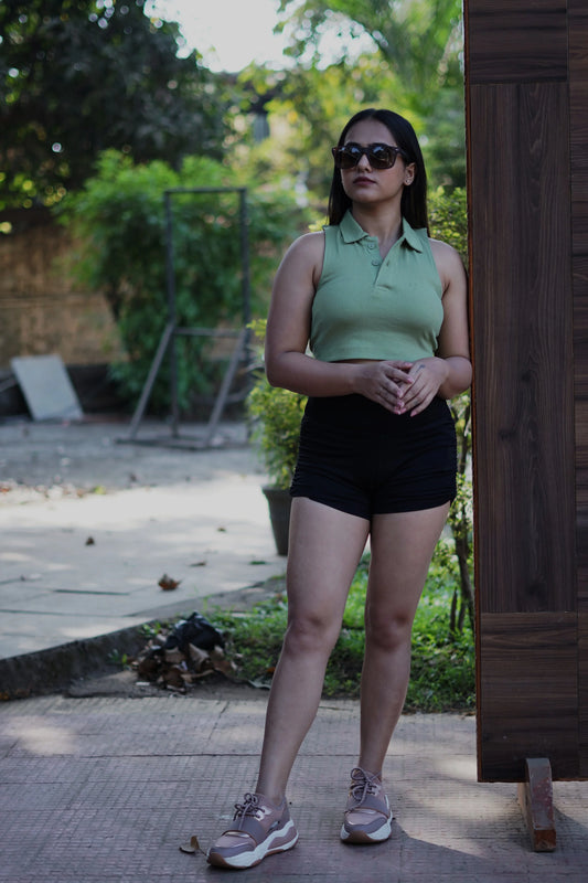  Set trends with this stylish green polo crop top, a fashion-forward and comfortable choice for expressing your unique style.