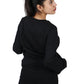 Stay on-trend with this trendy black oversized t-shirt, a versatile and stylish choice for expressing your individuality.