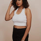 Embrace streetwear vibes with this cute white tank top crop, a stylish and urban addition to your wardrobe.