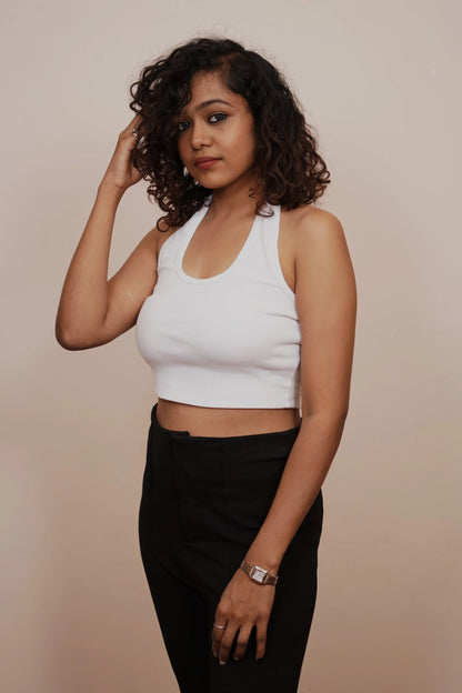 Embrace streetwear vibes with this cute white tank top crop, a stylish and urban addition to your wardrobe.