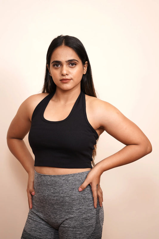  Fuse fashion with comfort in this women's black crop tank, a stylish and versatile addition to your everyday style.