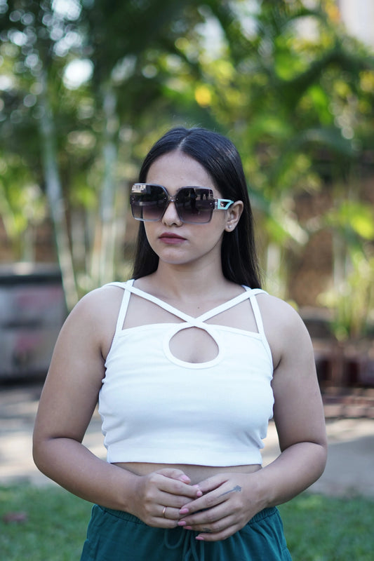 Add a touch of freshness to your girl's wardrobe with this crisp white tank top, a perfect staple for everyday wear.